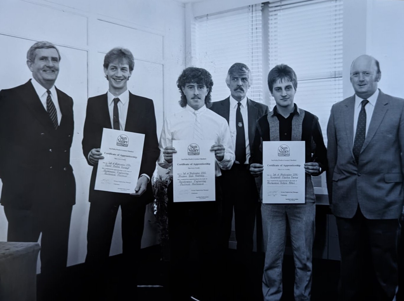 Sun Valley, 1986: Apprentices Tom Inglis, David Barnard, and Stephen Griffiths with safety and training manager Ron Aston and chief engineer Colin Clark