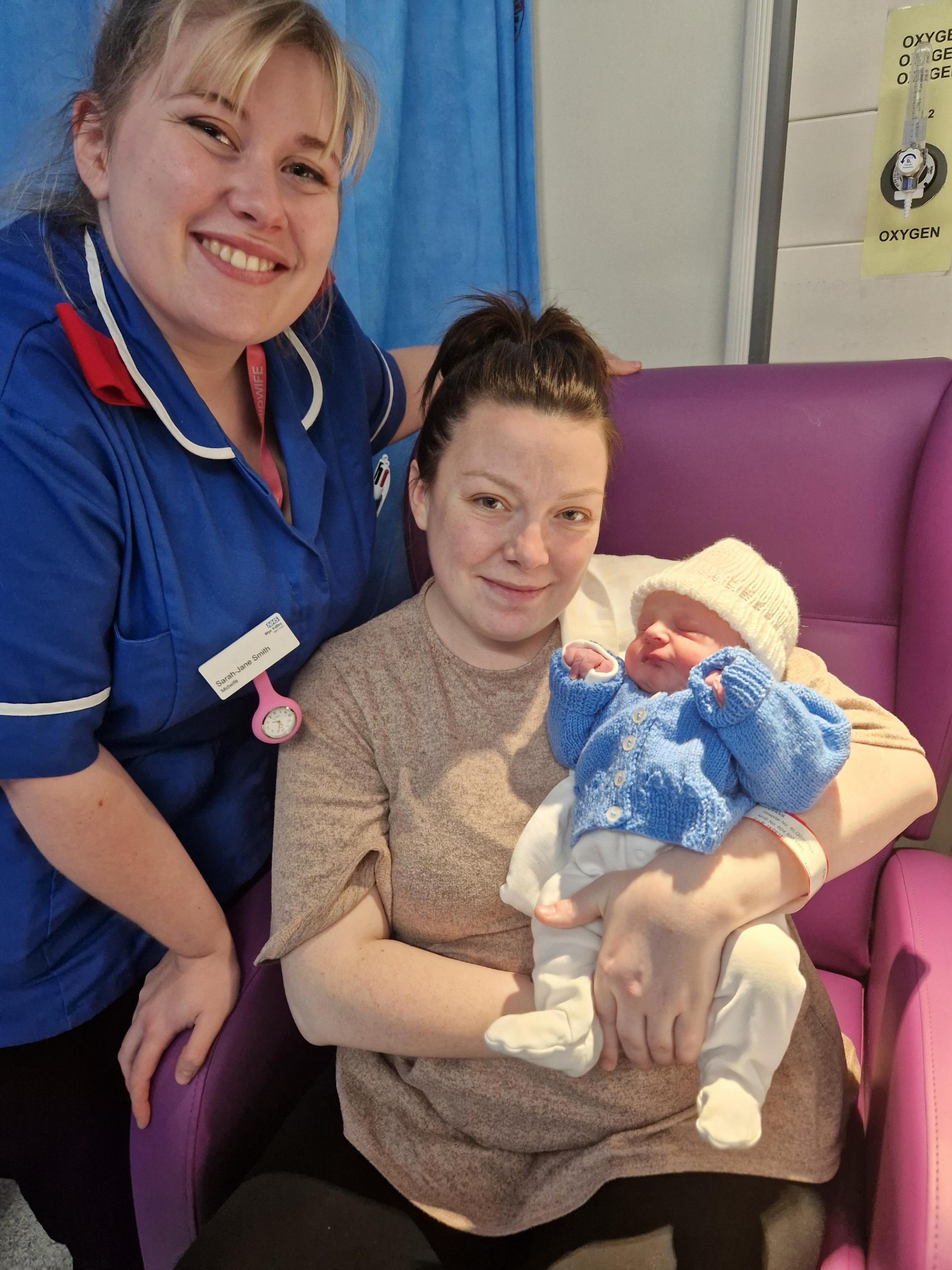 Babies born on New Years Day 2023 at Hereford County Hospital: Finlay, pictured with mum Charlie Evans and midwife Sarah-Jane Smith, was the first baby born at the hospital in 2023