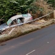 The car had crashed into a hedge