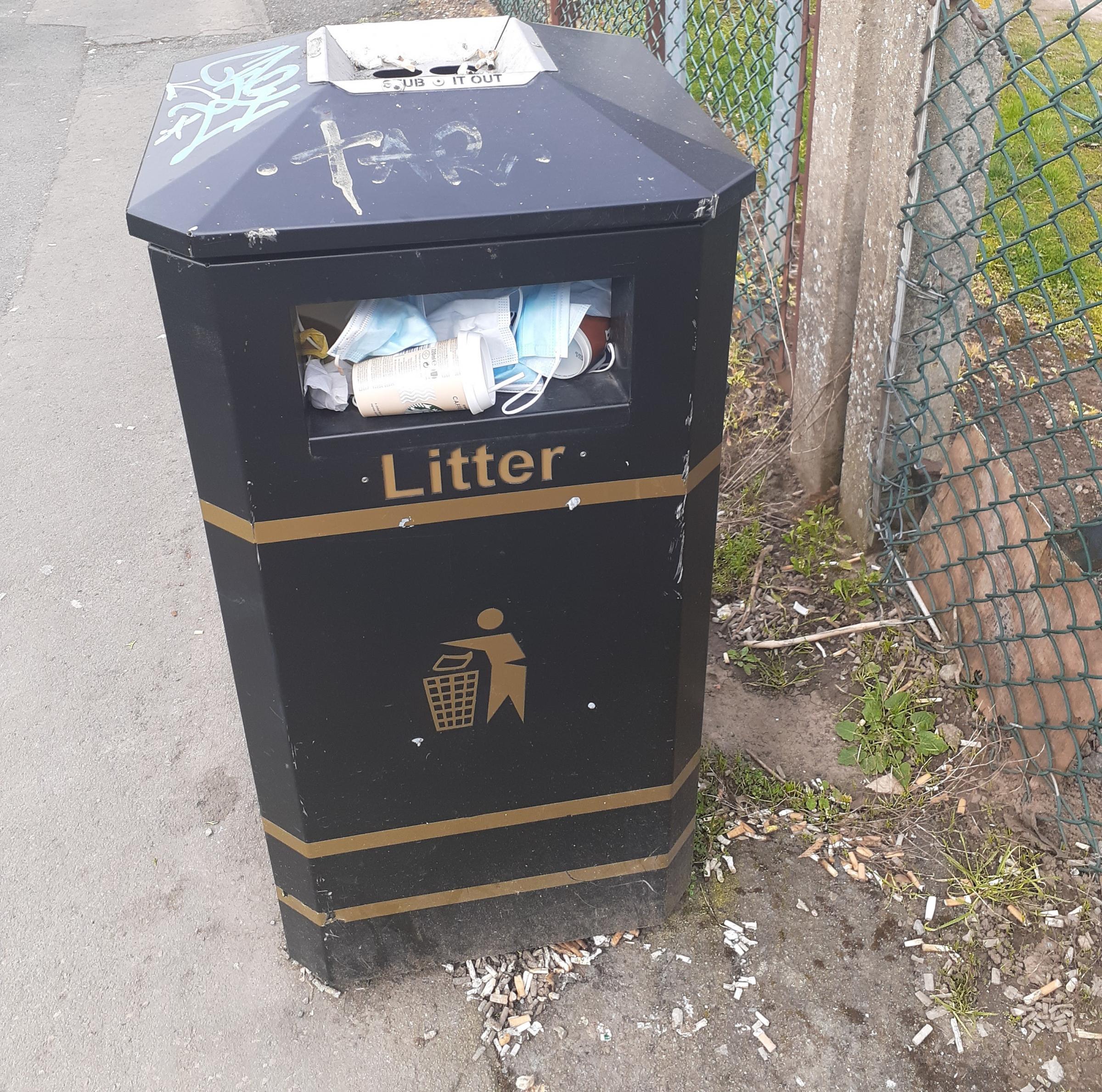 Cigarettes litter the ground around the bin near Hereford County Hospital. Photo: Stephen Jones