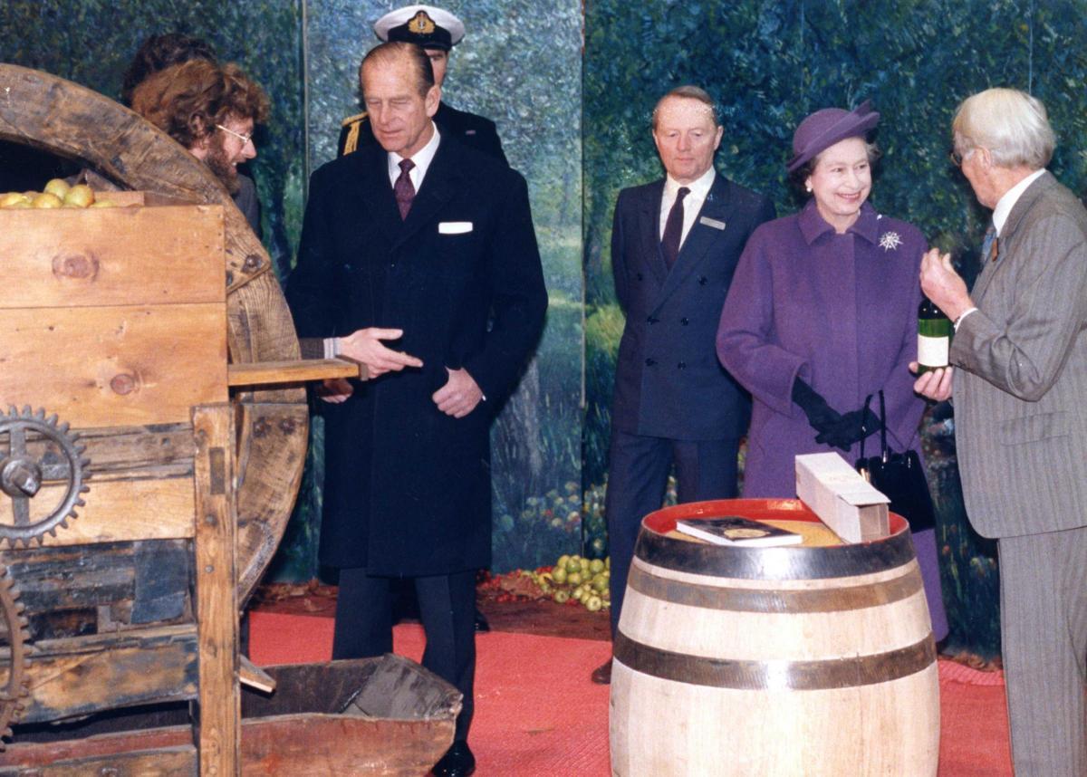 Cider Museum founder Bertam Bulmer, who resurrected cider brandy making, presents the Queen with the first bottle. Photo: Derek Evans Archive at Herefordshire Archives and Record Centre