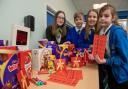 Gemma Woosnam (Sales Adviser) with the pupils at Ledbury Primary School following the Easter bingo sponsorship