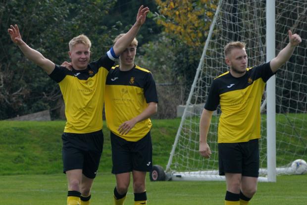 Jack Gittoes (left) celebrates his goal with Will Bowen and Jake Robinson for Kington Town during their 2-0 win over New Dales Vale. Picture: Andy Compton