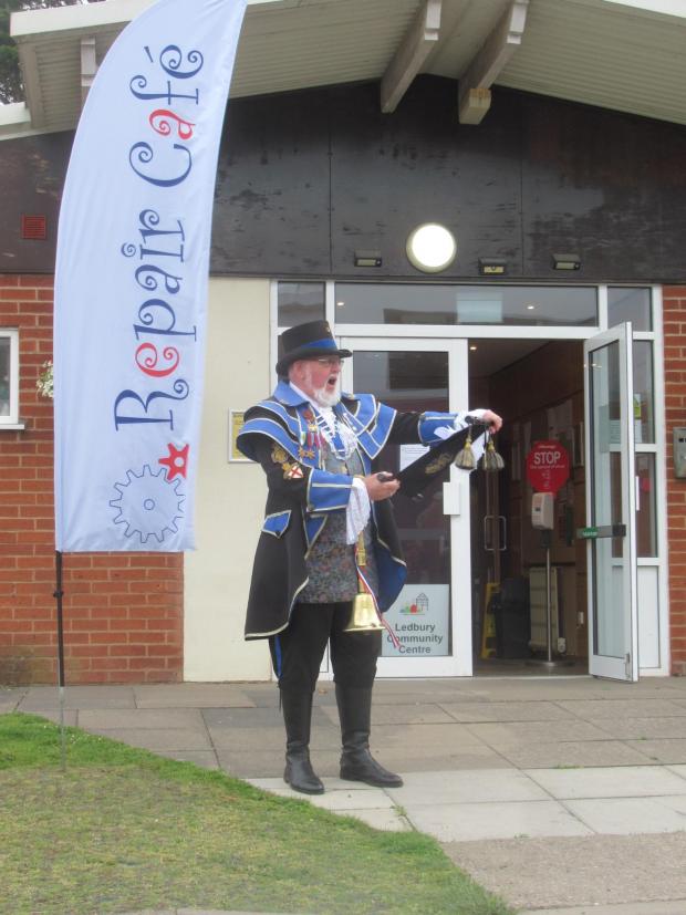 Ledbury Reporter: A town crier outside the Repair Cafe, which was filmed on Ledbury Community Day