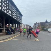Runners set off for the Mayor's Mile from the Market House