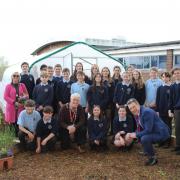 Mayor Phillip Howells, consort Hilary Jones and headteacher Andy Evans with Year 8 pupils at JMHS