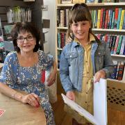 Suzan Alderton with young reader Nanci Brown
