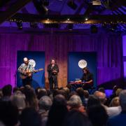 Poet Laureate Simon Armitage playing with his band LYR at Ledbury Poetry Festival's closing night in 2023