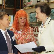 Henry Dukes, pictured with Lady Judith McAlpine (centre) and National Transport Trust patron Princess Anne (right) collects his award certificate.