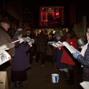 Shoppers and entertainment in Ledbury town centre
