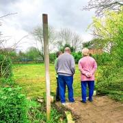 Glenn Ward and wife Esme admire their renovated garden