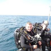 AB(D) Simon Smyth about to dive on the wrecked aircraft off the coast of Italy.