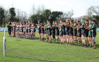 APPLAUSE: Players from Ledbury and Bromyard pay their respects to Jack Jeffery before the game. Pic: Beth Jones