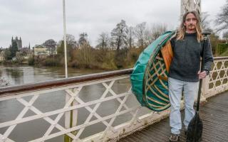 Pete Reddings with his coracle by the river Wye in Hereford